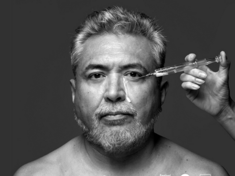 photo of a man being injected in his face