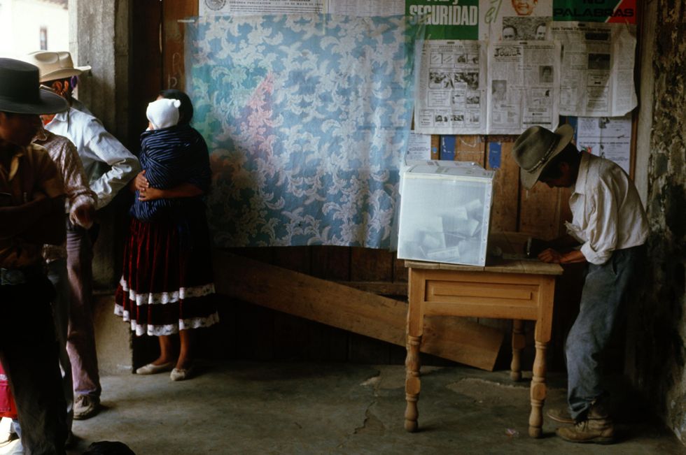 Photo of a man casting his ballot during local elections in Mexico