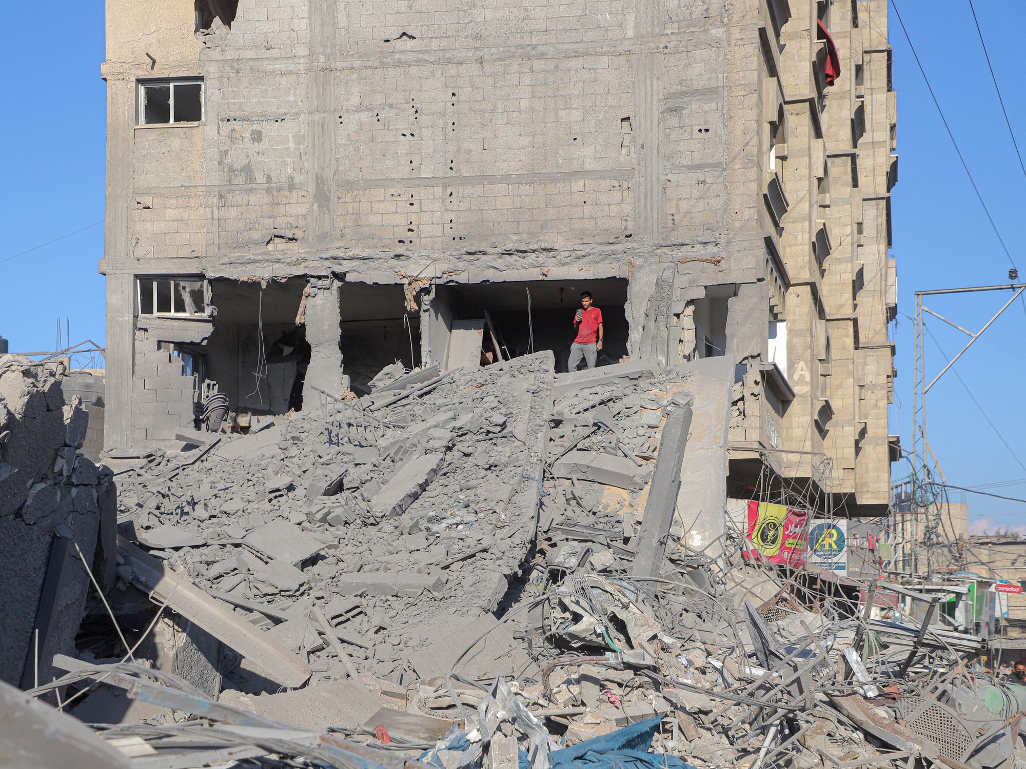Photo of a man is seen among the rubble in Gaza
