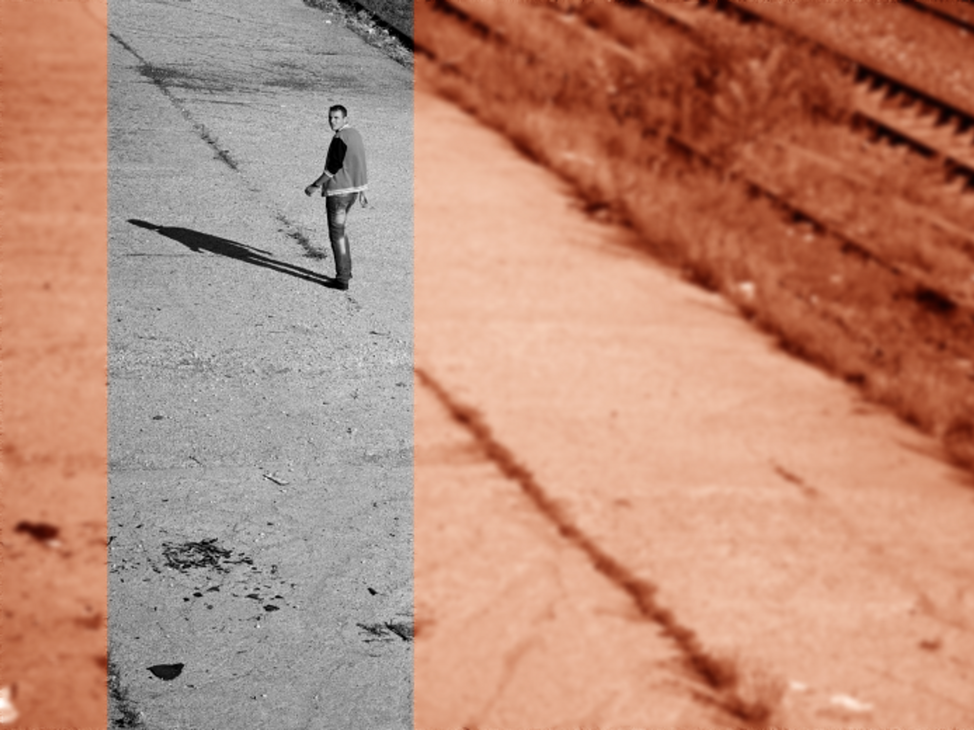 Photo of a man looking back while walking away