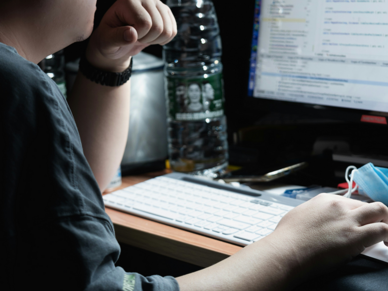 Photo of a man on a computer
