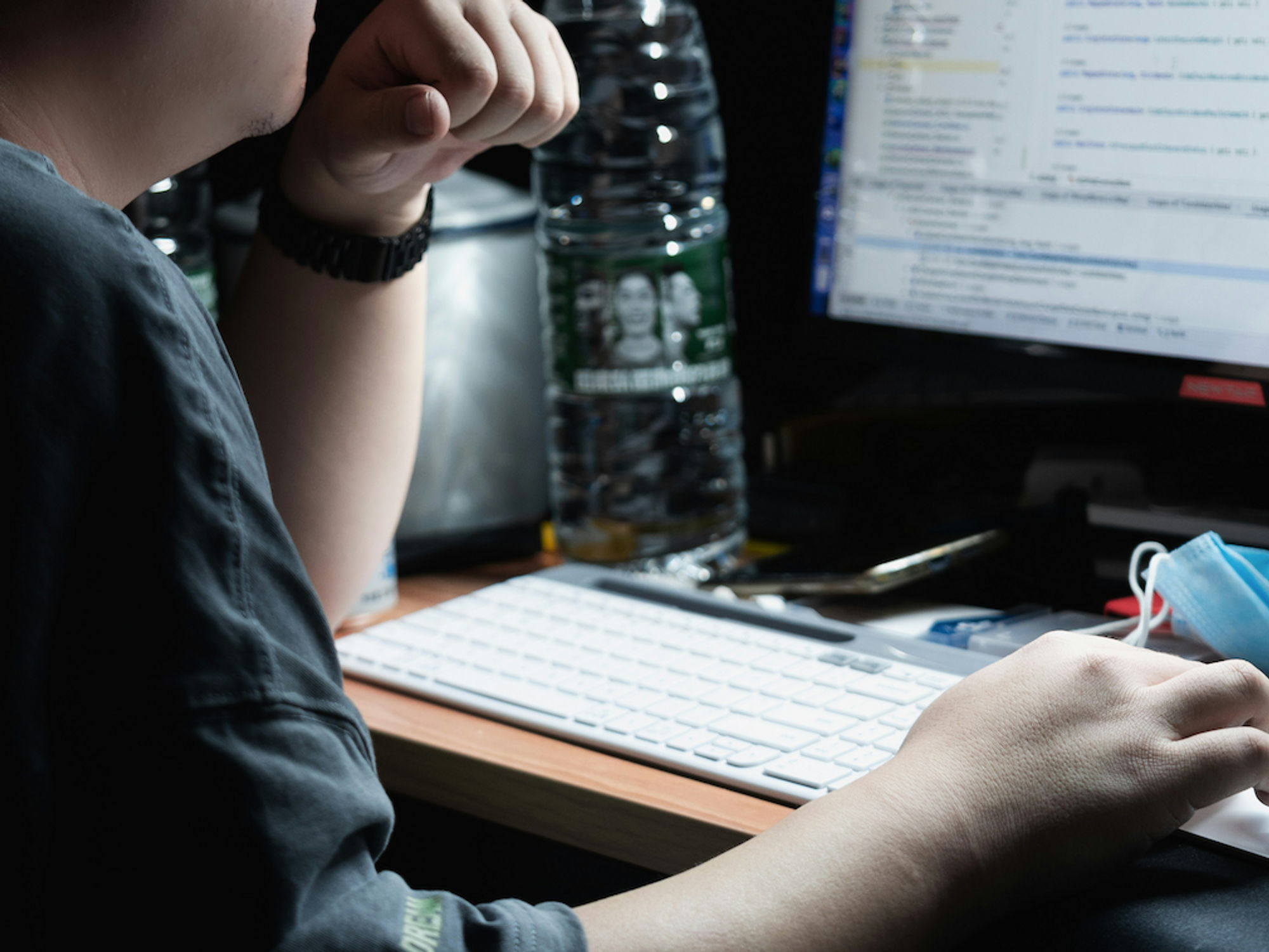 Photo of a man on a computer