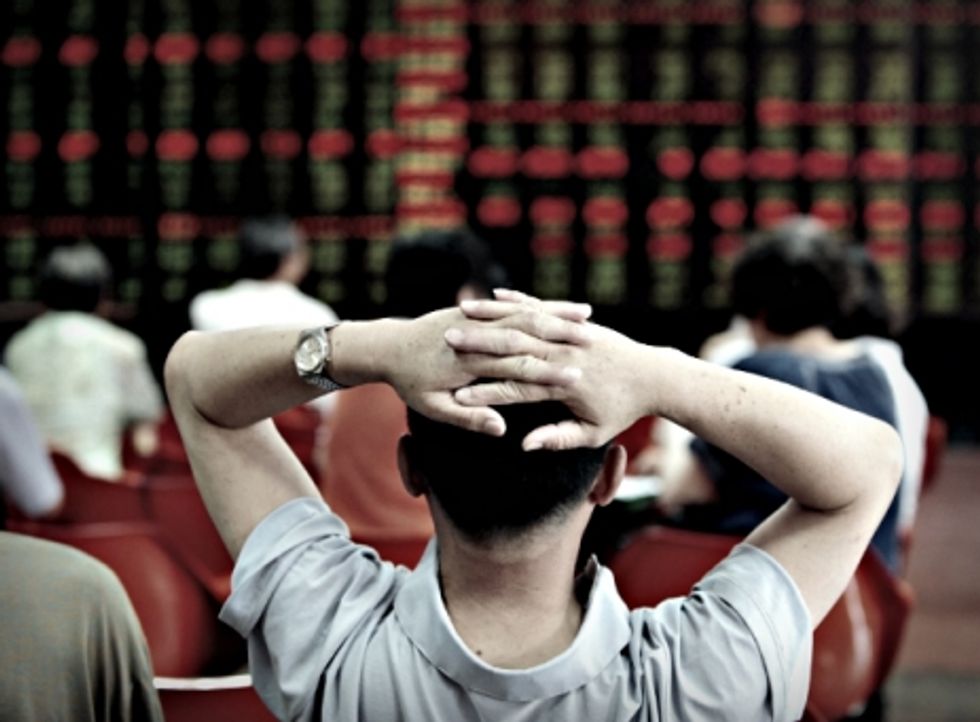 Photo of a man reclining on a chair at a stock exchange building in northeastern China