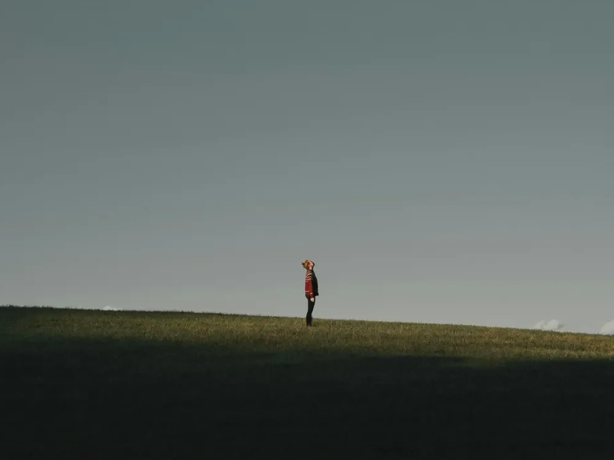 Photo of a man standing in a field