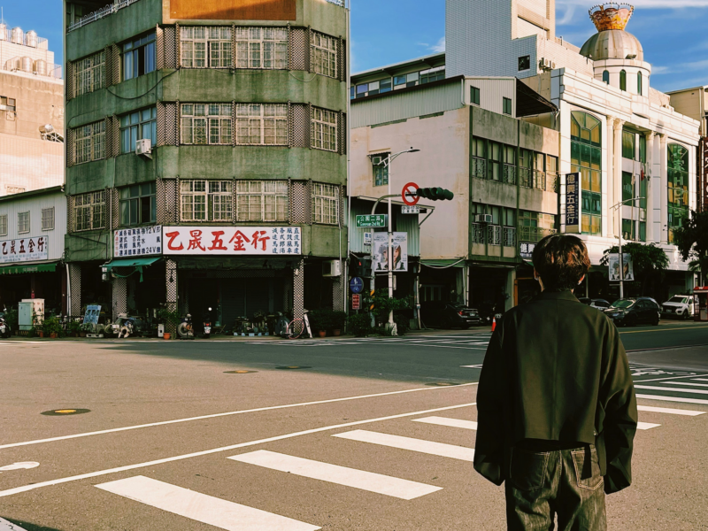Photo of a man standing near buildings in Taiwan