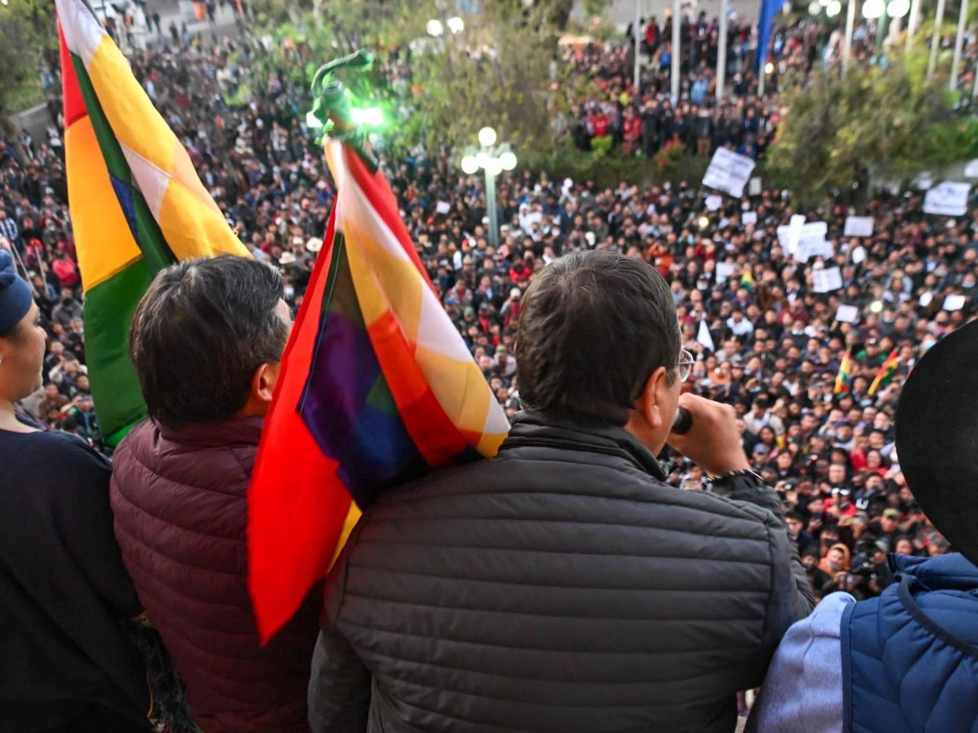 photo of a man talking to a crowd from a balcony