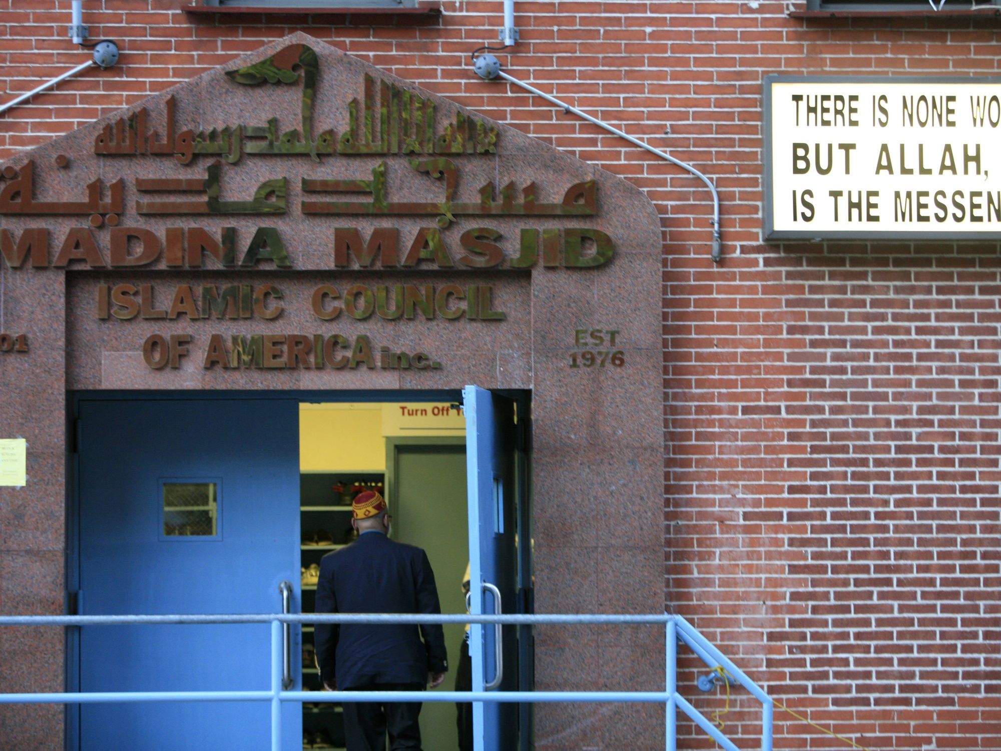 Photo of a man walking into a mosque in NYC