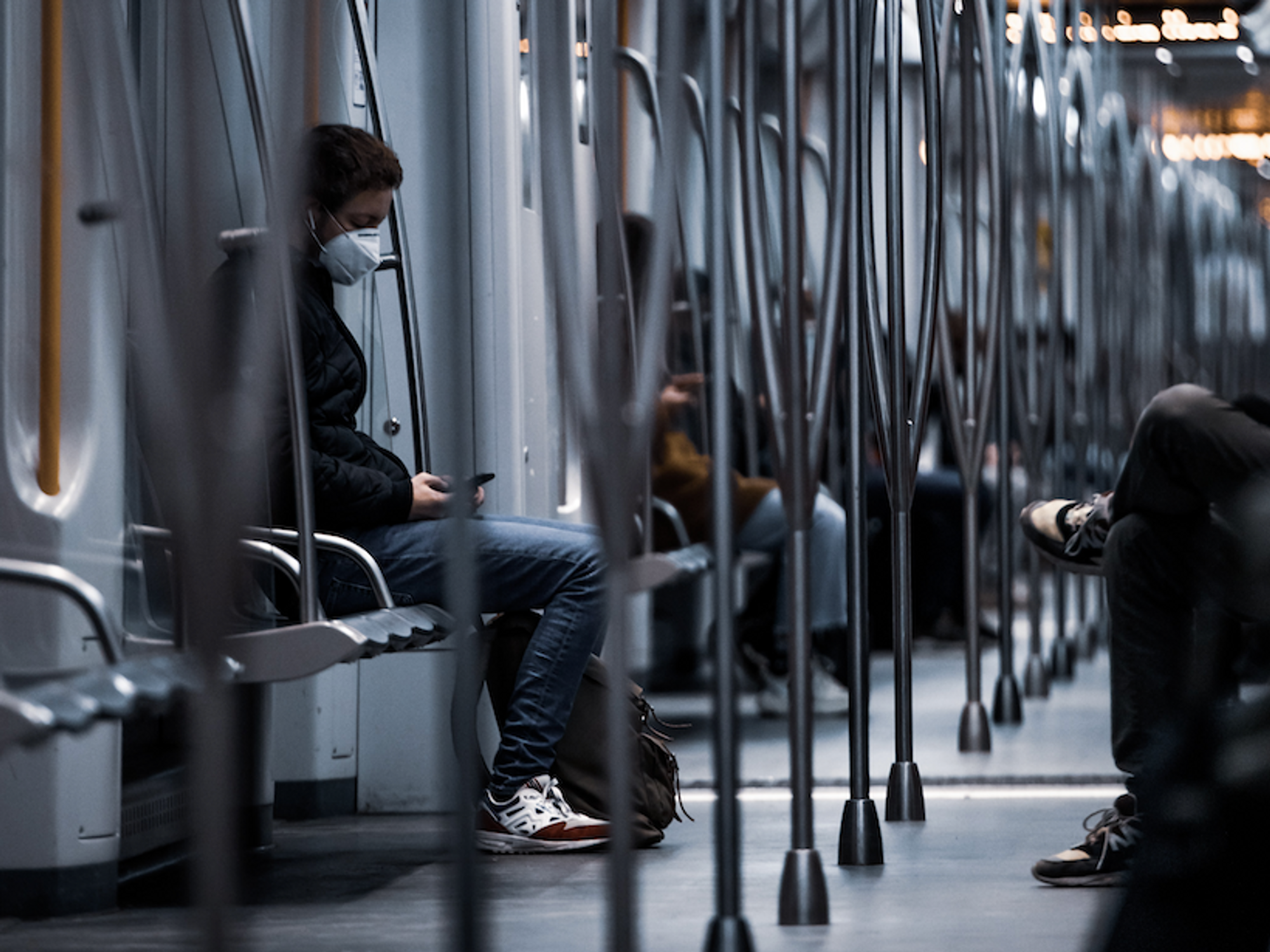 Photo of a man wearing a COVID-19 mask on a subway in Amsterdam