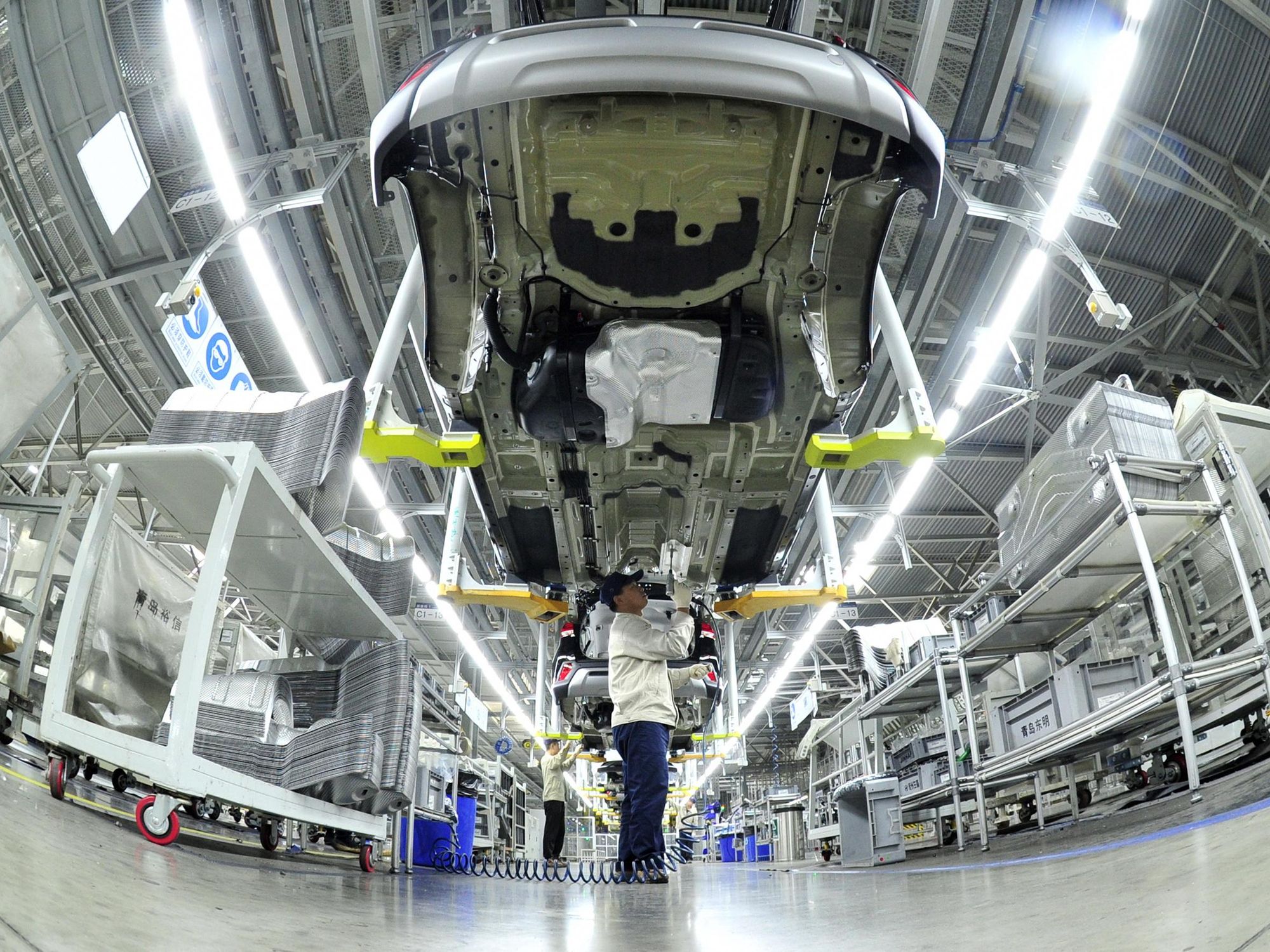 Photo of a man working at the Hyundai car plant in Cangzhou City.