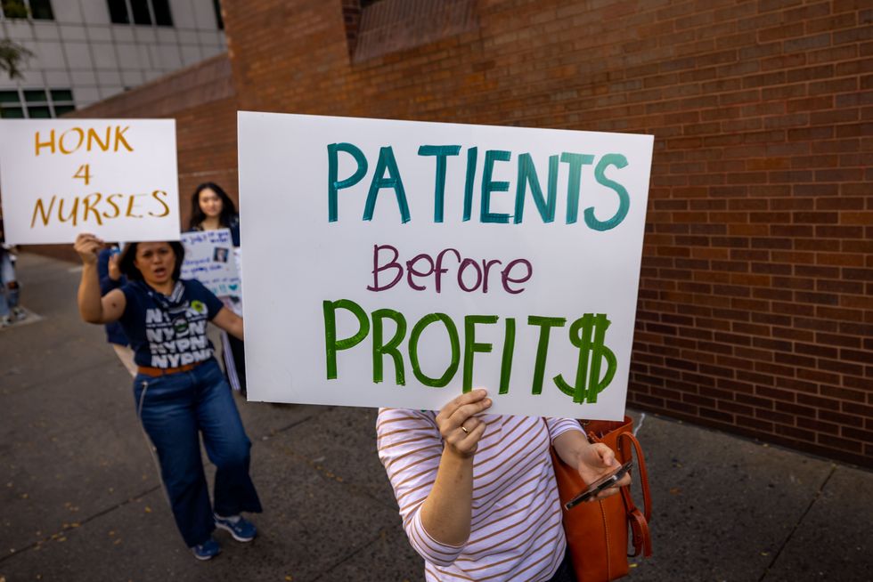 photo of a march with patients before profits sign
