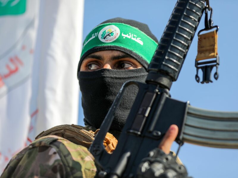Photo of a member of the al-Qassam Brigades, the military wing of the Palestinian Hamas, in the central Gaza Strip, carrying a rifle.