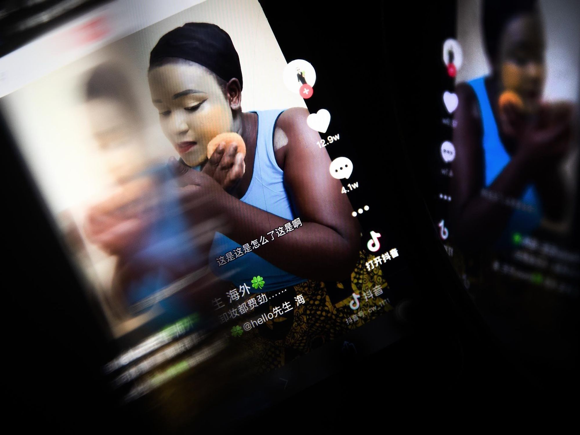 Photo of a mobile phone displaying an "African makeup" tutorial on Douyin, TikTok's version of its platform designed for the Chinese market