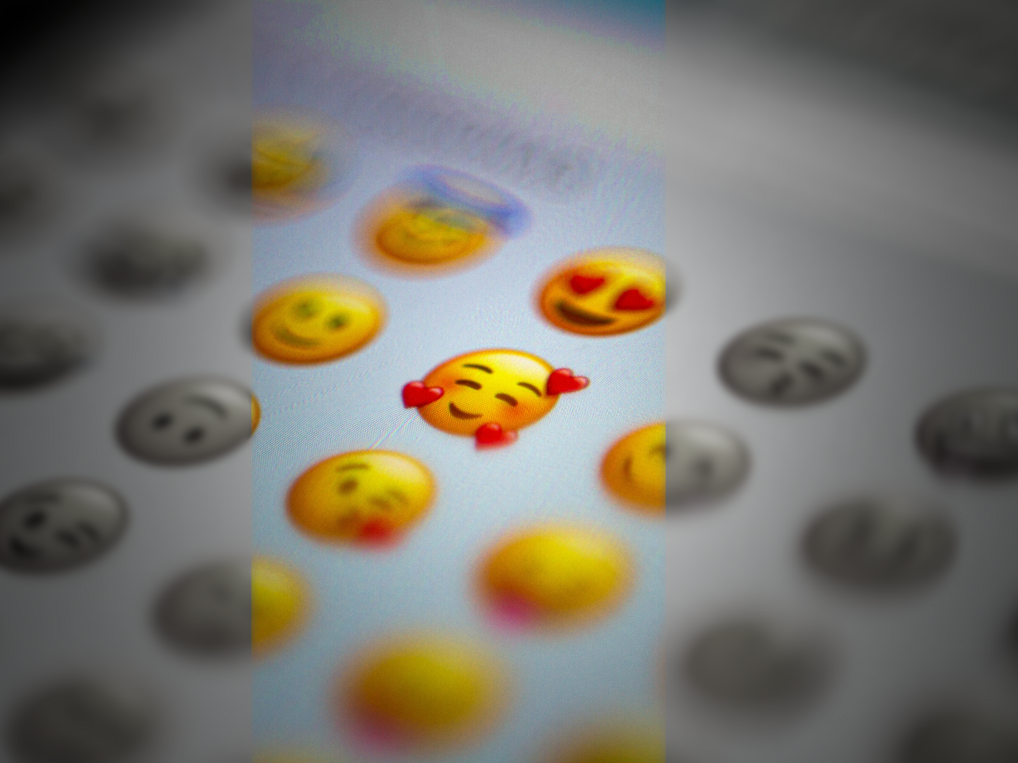 Photo of a mobile phone screen displaying a series of emojis
