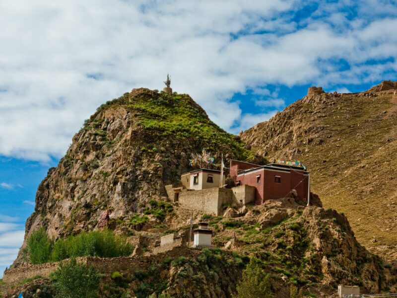 photo of a monastery on a hilltop in Tibet