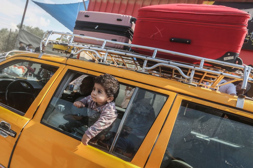 Photo of a Palestinian child in a car at the Rafah border crossing in southern Gaza.