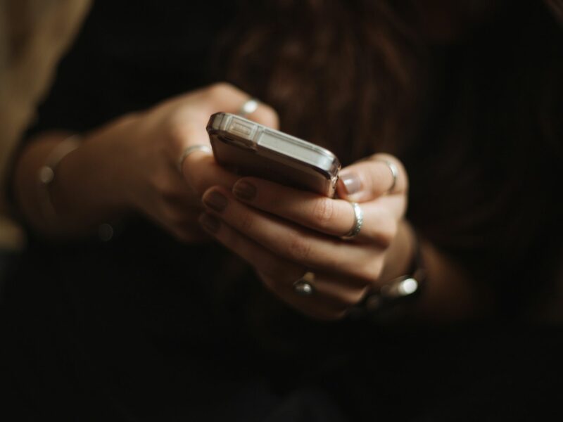 Photo of a person using a smartphone