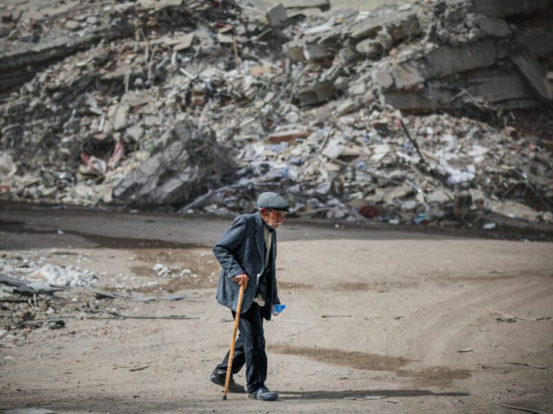 Photo of a person walking in the aftermath of Turkey's earthquake