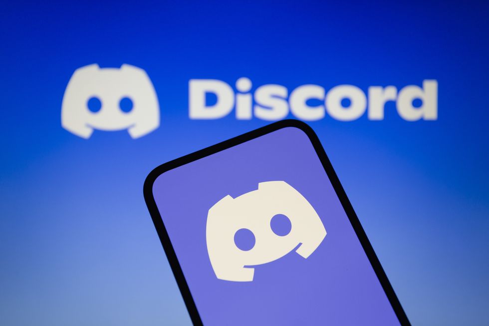 Photo of a phone displaying the logo of the Discord messaging app
