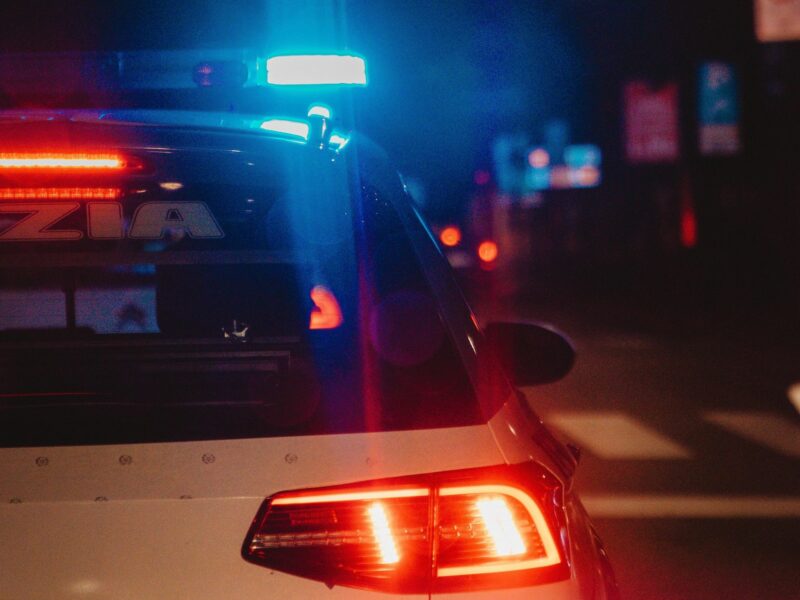 photo of a police car at night
