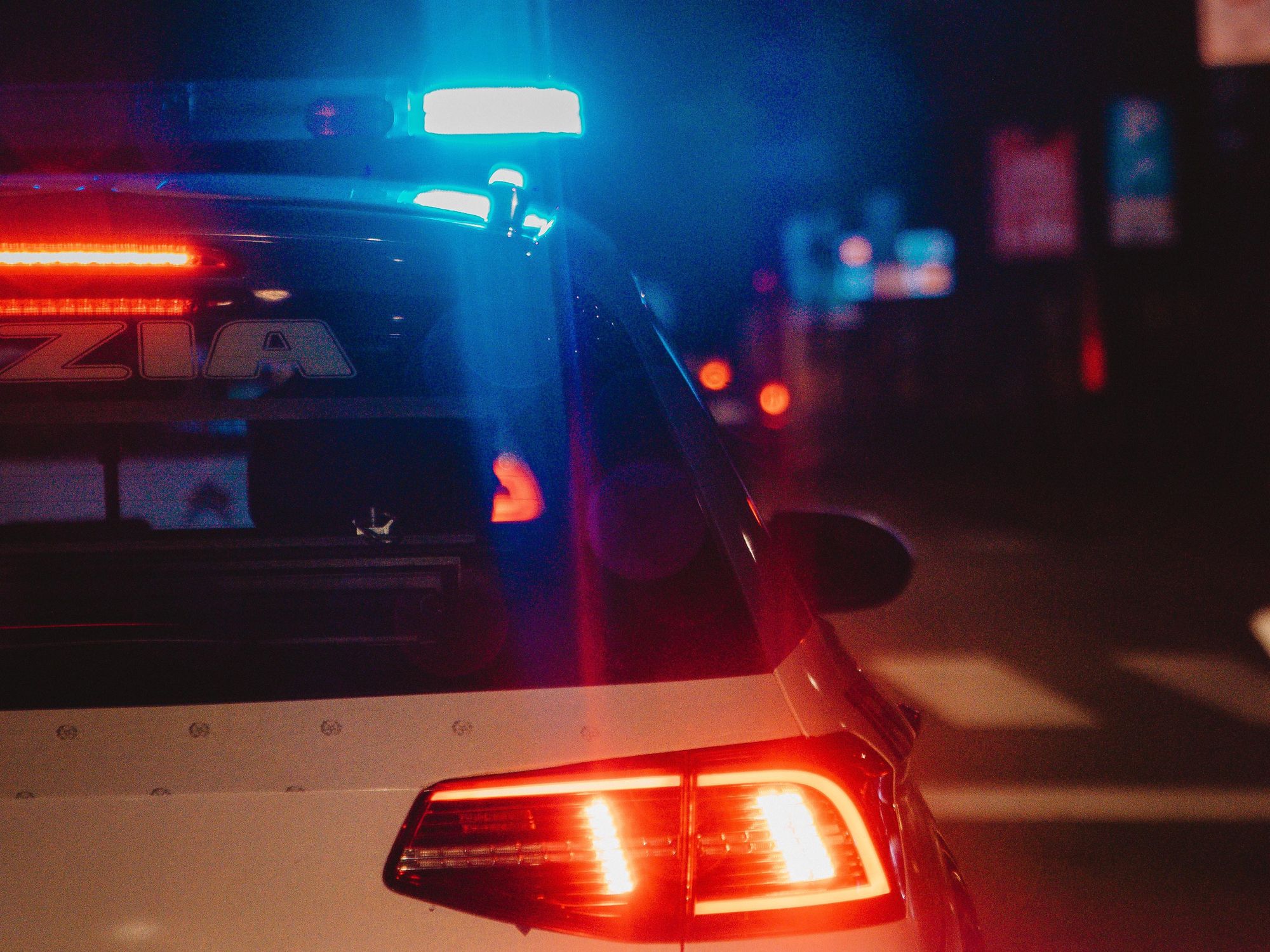 photo of a police car at night