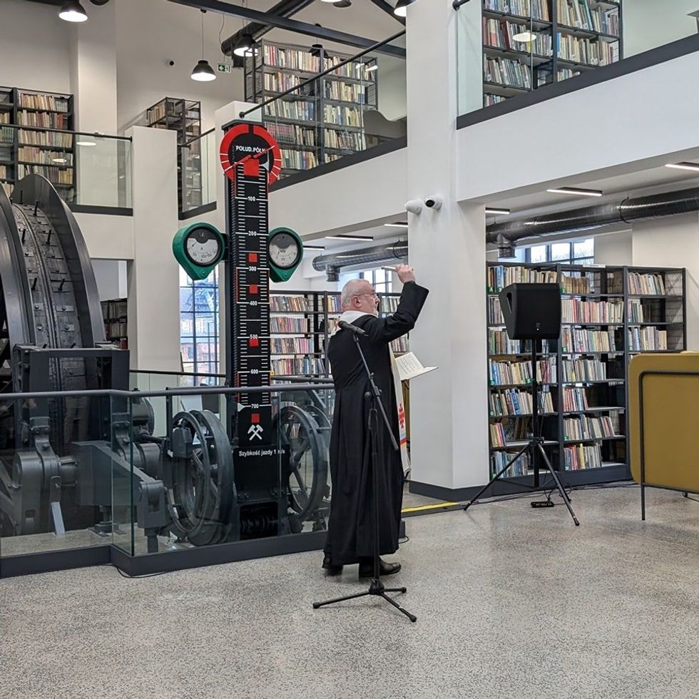 Photo of a priest blessing the Anna mine library in​ Pszów, Poland