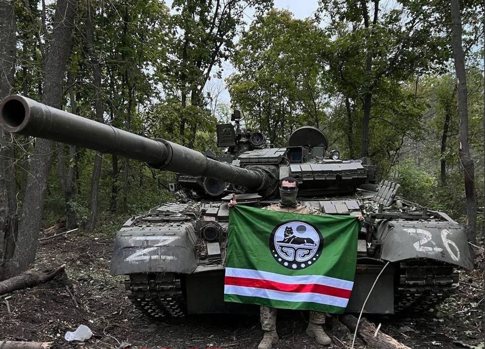 Photo of a pro-Ukrainian Chechen fighter who captured a Russian tank