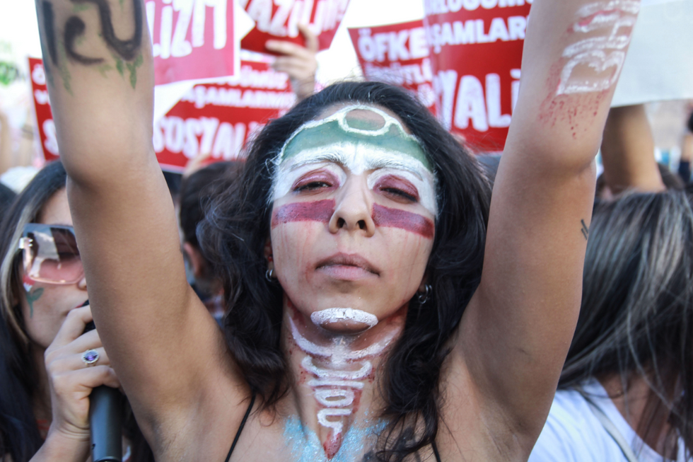 Photo of a protester in Istanbul with the flag of Iran painted on her face, following Mahsa Amini’s death in Tehran.