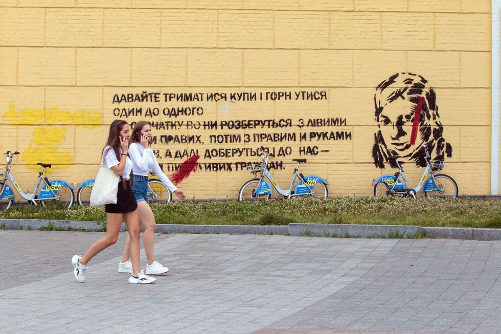 Photo of a quote by late anti-corruption activist Kateryna Handziuk on a wall in Kyiv