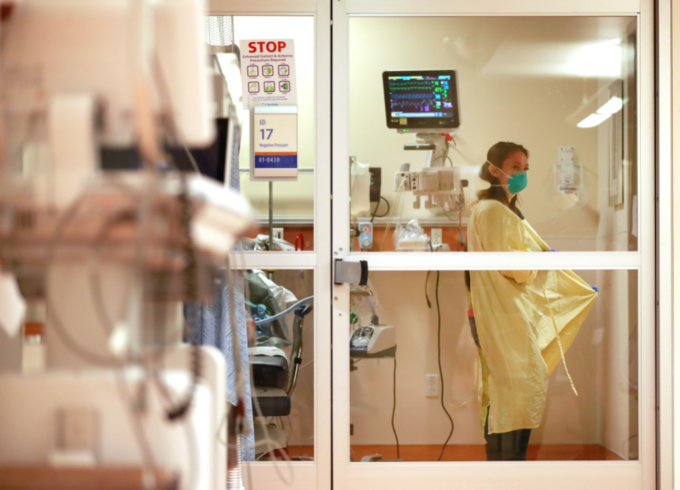 Photo of a respiratory therapist in COVID protective attire in an emergency room at Scripps Memorial Hospital La Jolla, U.S.