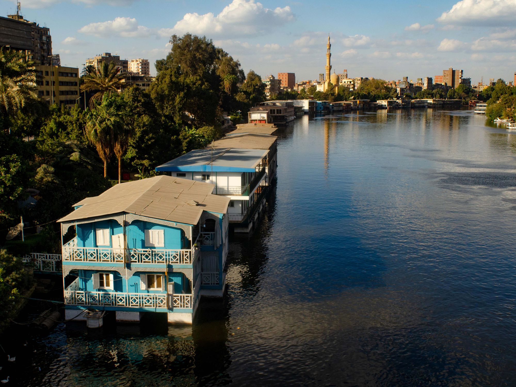 Photo of a row of houseboats floating on the Nile in Cairo, Egypt