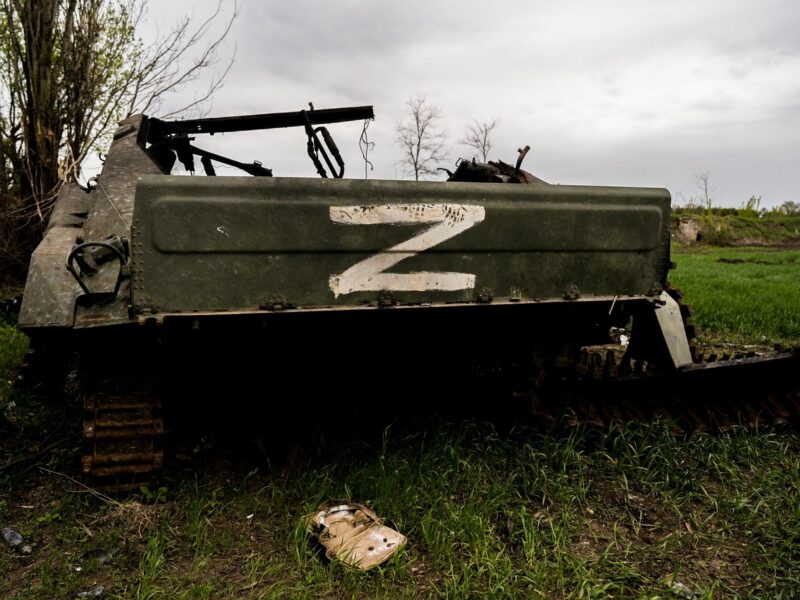 Photo of a Russian tank destroyed during street fighting in Mala Shestirnya in Ukraine, with a white letter "Z" painted on the side.