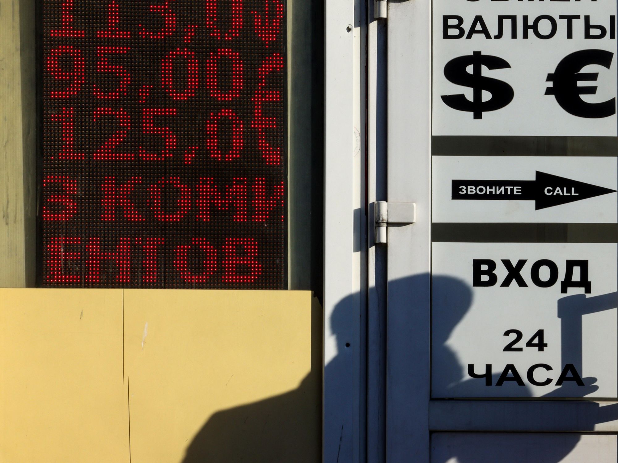 Photo of a shadowy silhouette outside a ​currency exchange office in Moscow on March 2.