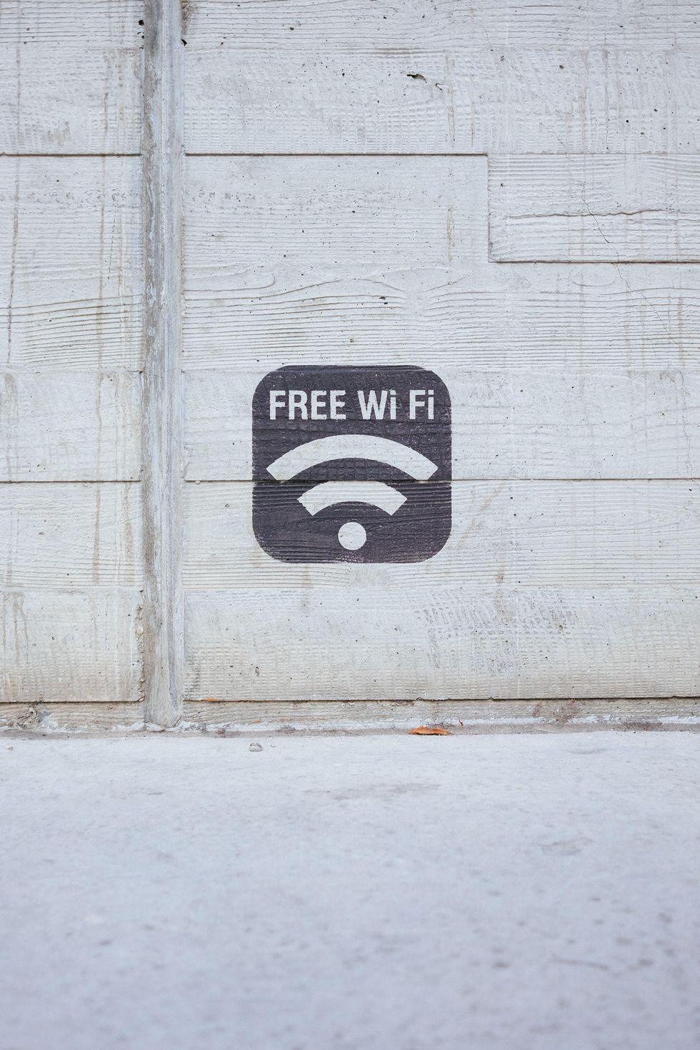 photo of a sign for free WiFi on a wall