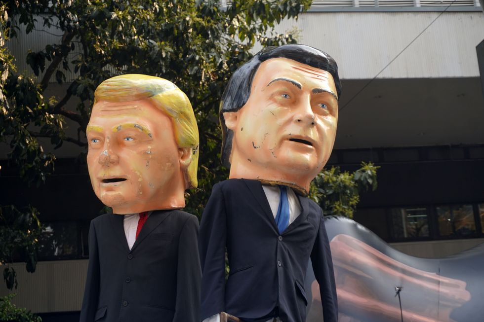 Photo of a sign showing Donald Trump and Elon Musk by supporters of former Brazilian President Jair Bolsonaro.