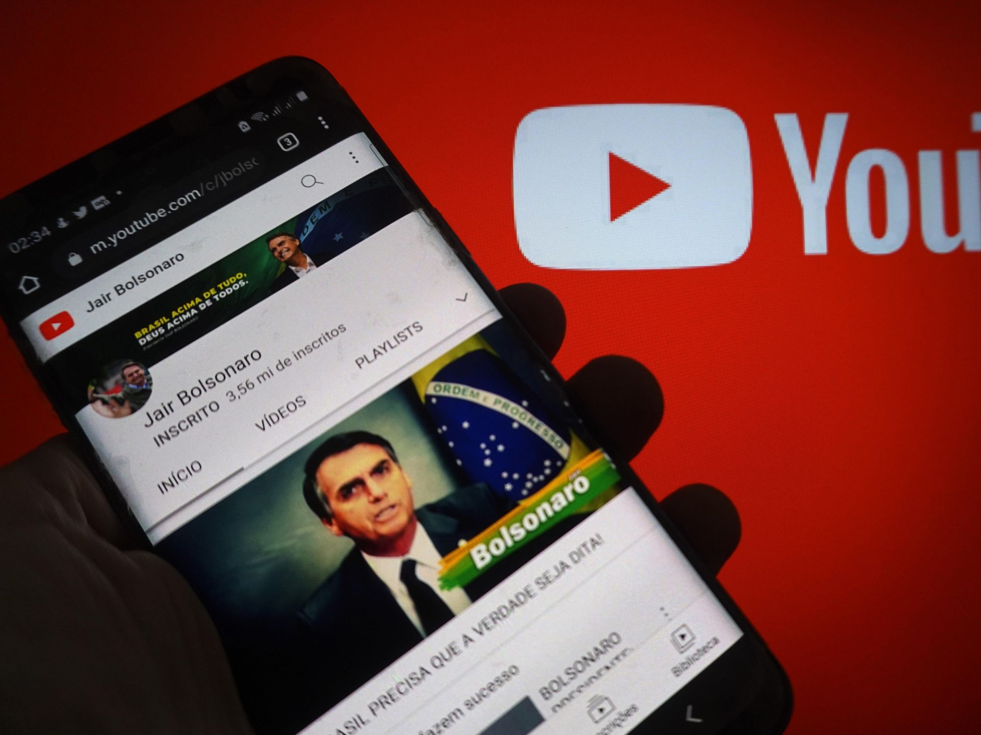 photo of a smartphone with Jair Bolsonaro's photo and youtube