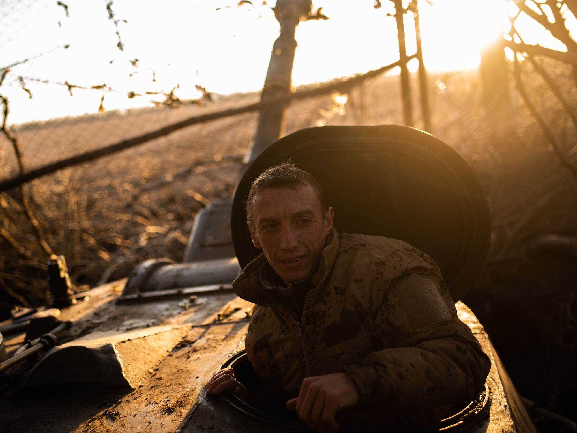 photo of a soldier coming out of a tank