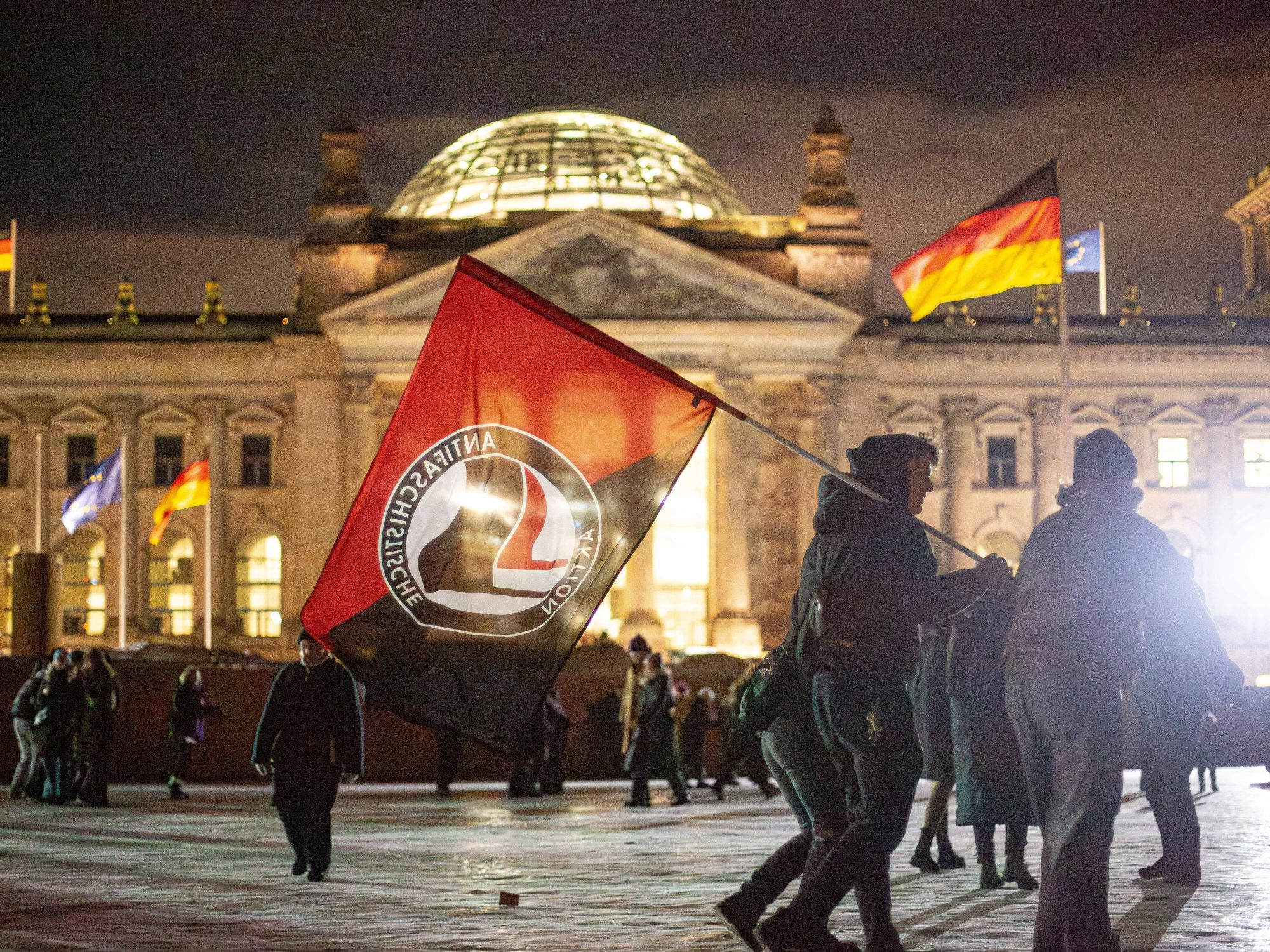 photo of a square of protesters with flags