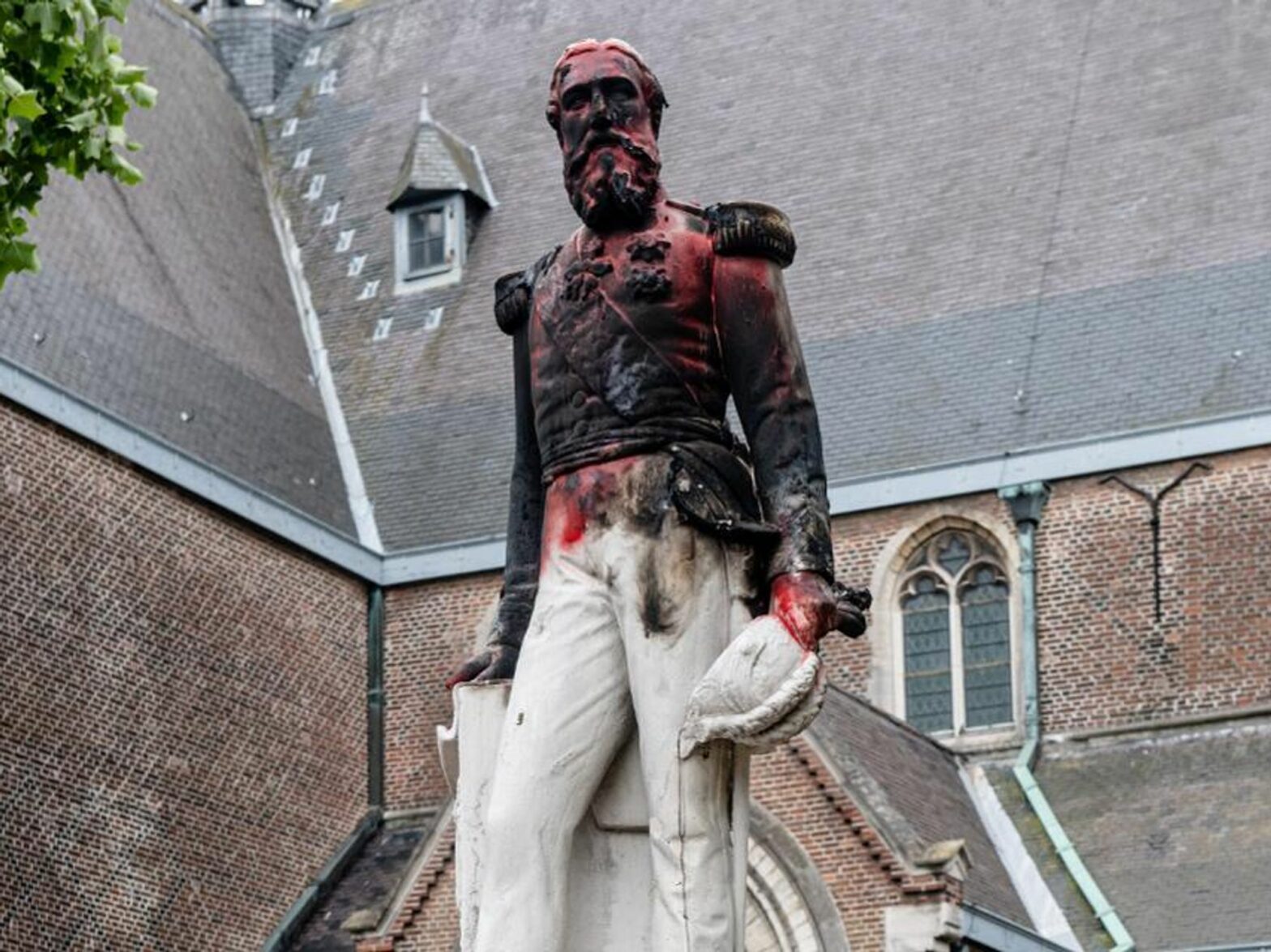 photo of a statue of King Leopold II in Antwerp, Belgium, vandalized during anti-colonial protests in 2020.