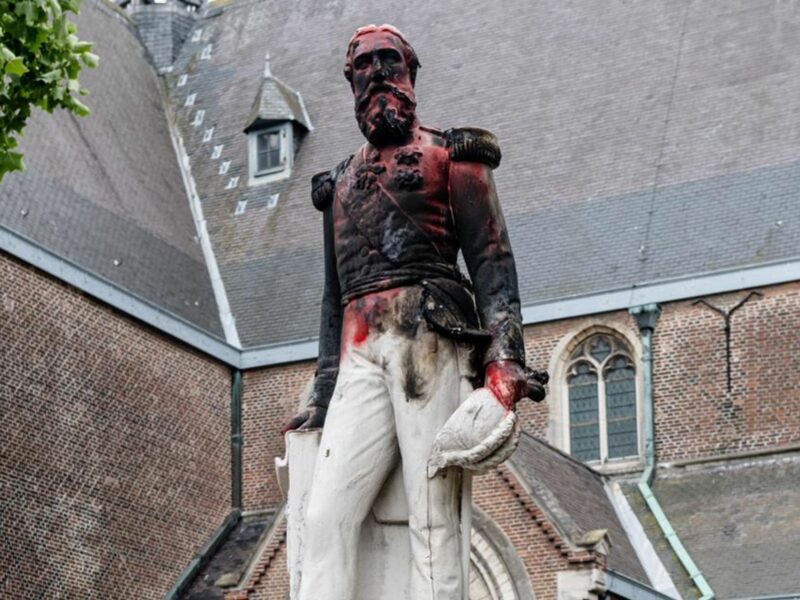 photo of a statue of King Leopold II in Antwerp, Belgium, vandalized during anti-colonial protests in 2020.