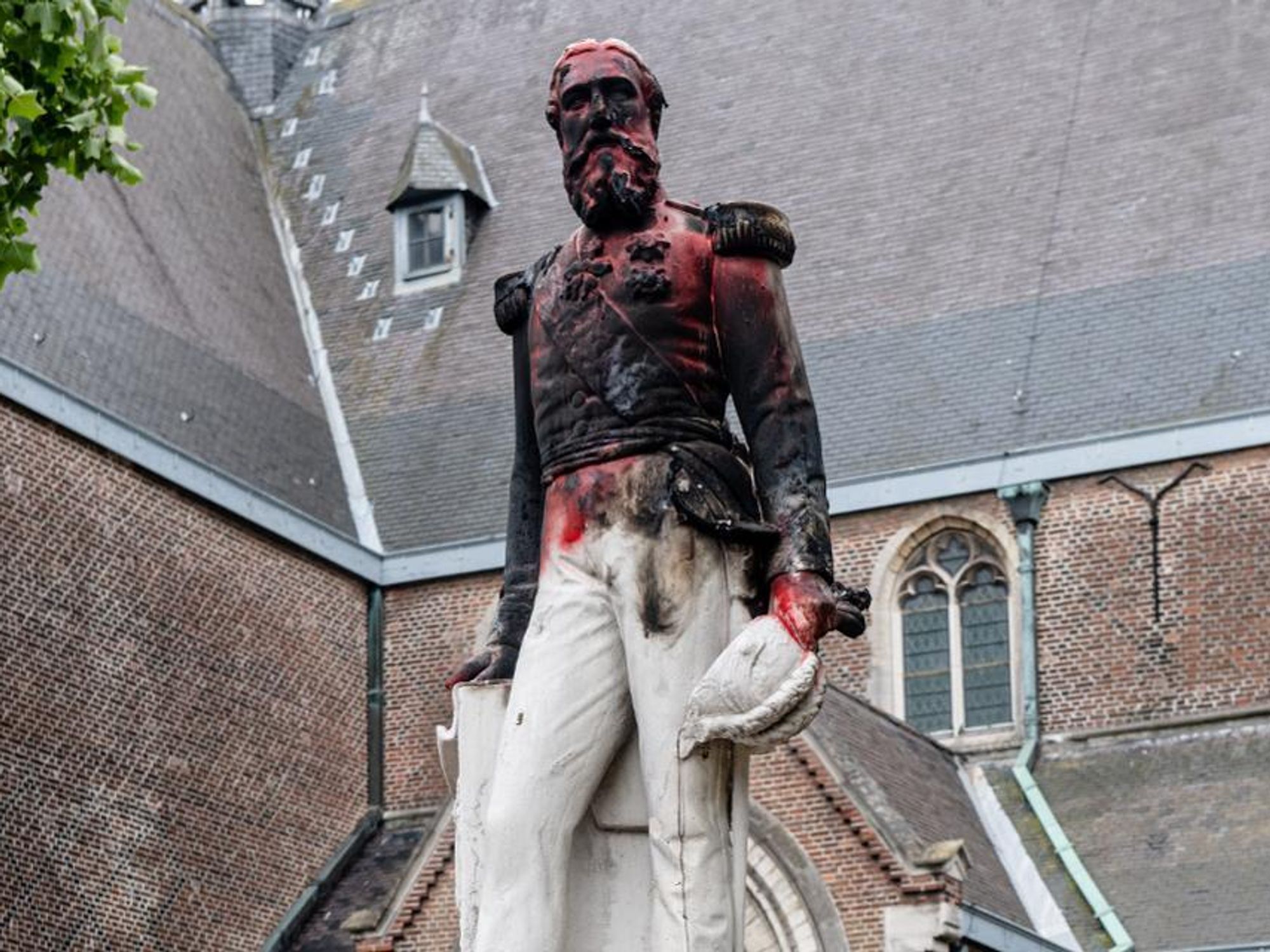 photo of a statue of King Leopold II in Antwerp, Belgium, vandalized during anti-colonial protests in 2020.