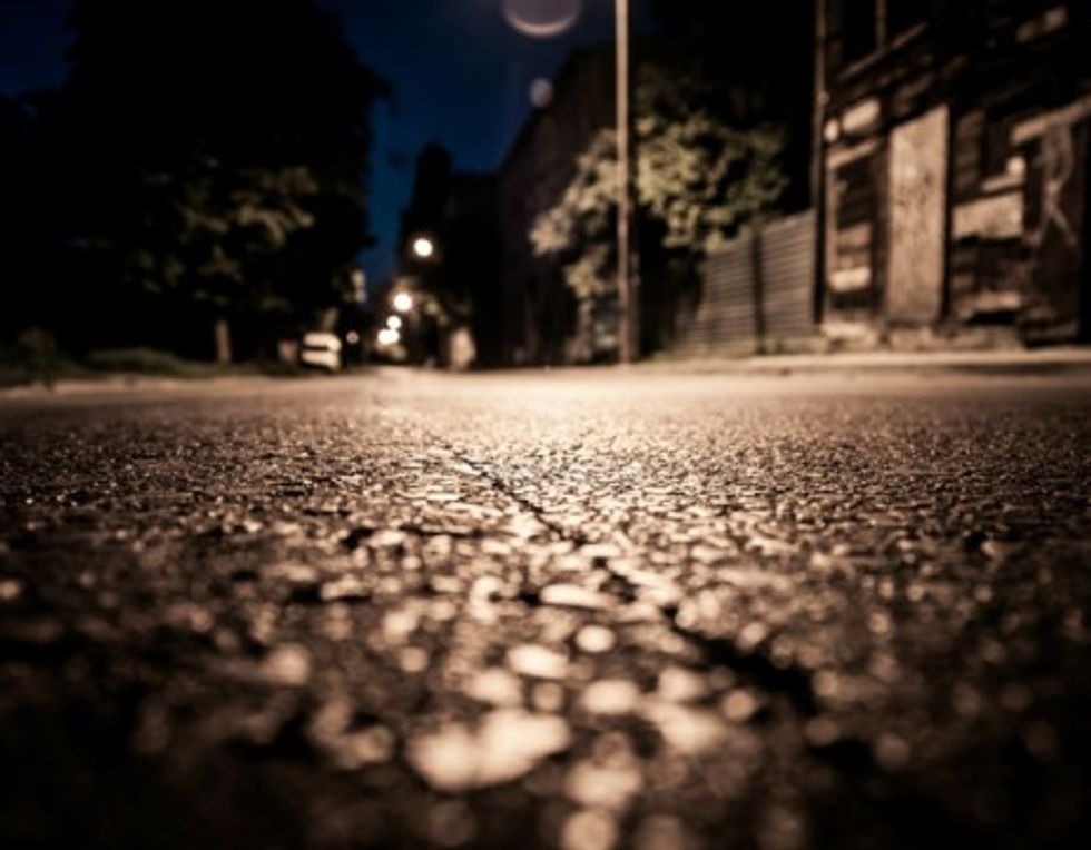 Photo of a street in Lodz by night