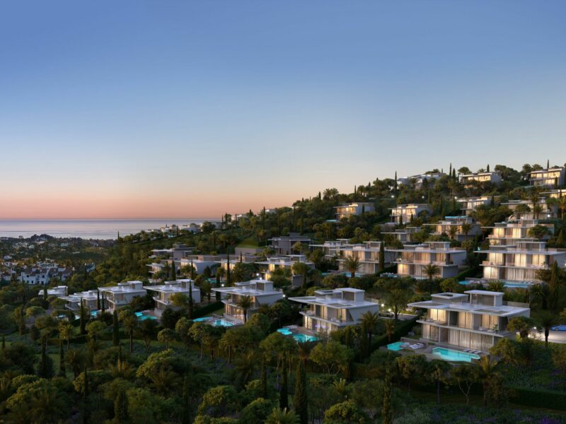 Photo of a sunset on villas on a hillside in Benahavis, Spain
