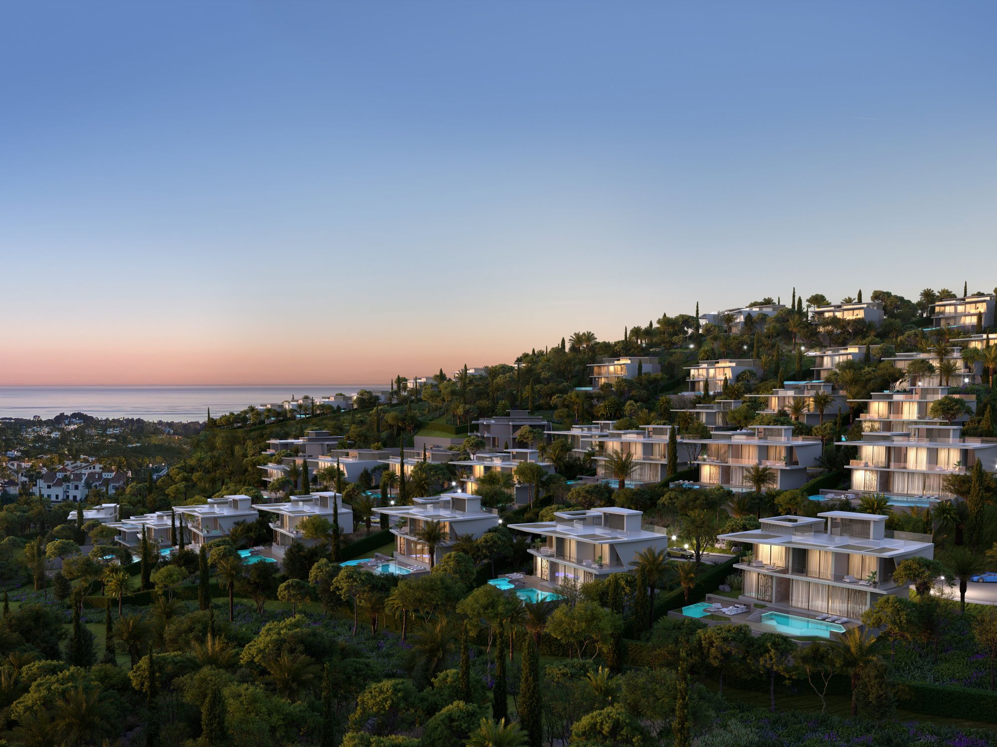 Photo of a sunset on villas on a hillside in Benahavis, Spain