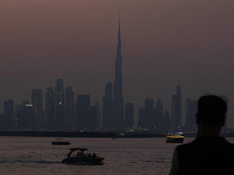 Photo of a sunset over Dubai Creek Harbor with the Dubai skyline in the background