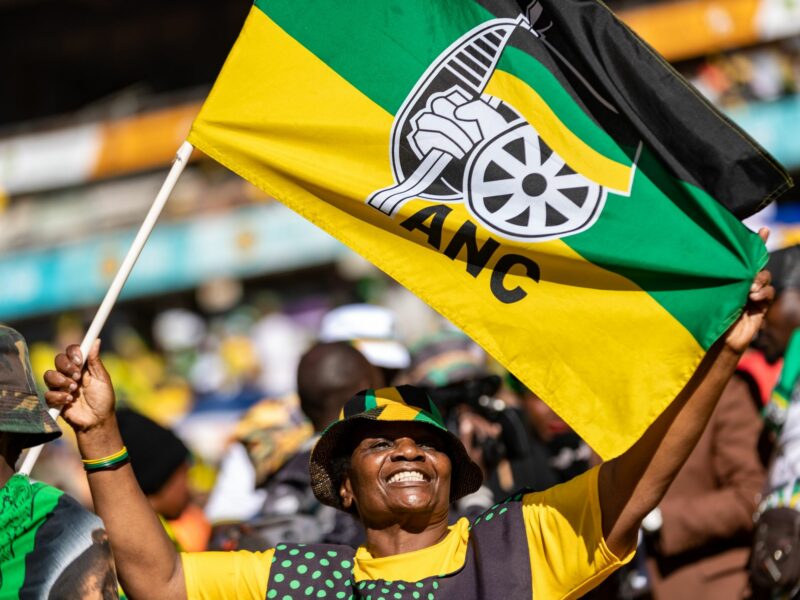 Photo of a supporter waving a flag of the African National Congress (ANC) party waves a flag during the party's final rally ahead of the election, in Johannesburg on May 25