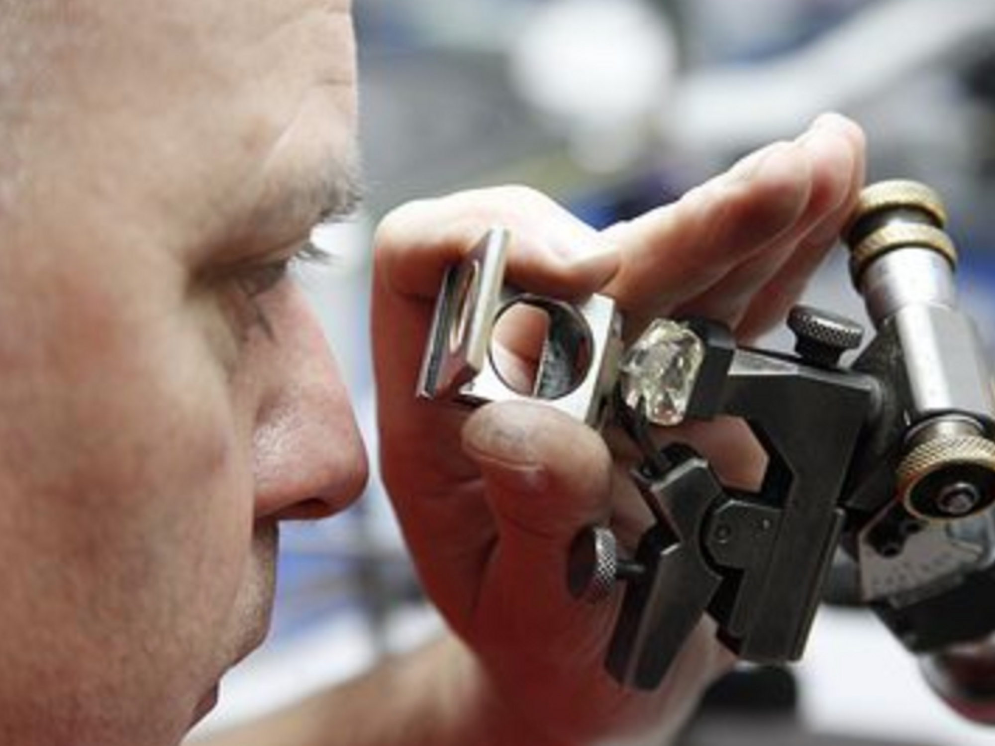 Photo of a technician examining the condition of a diamond in Antwerp, Belgium