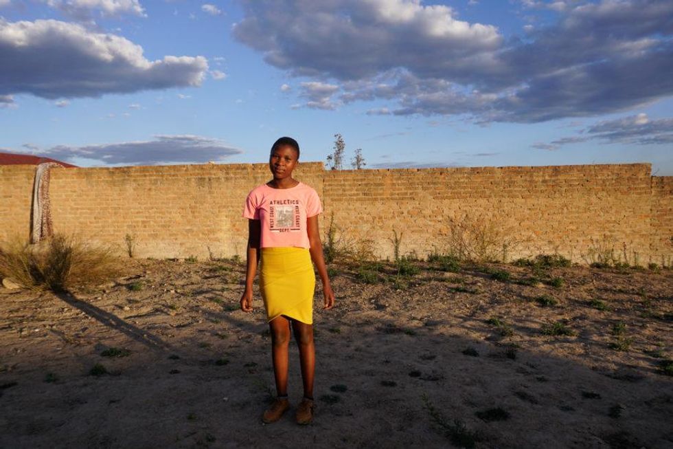 photo of a teenage girl standing alone