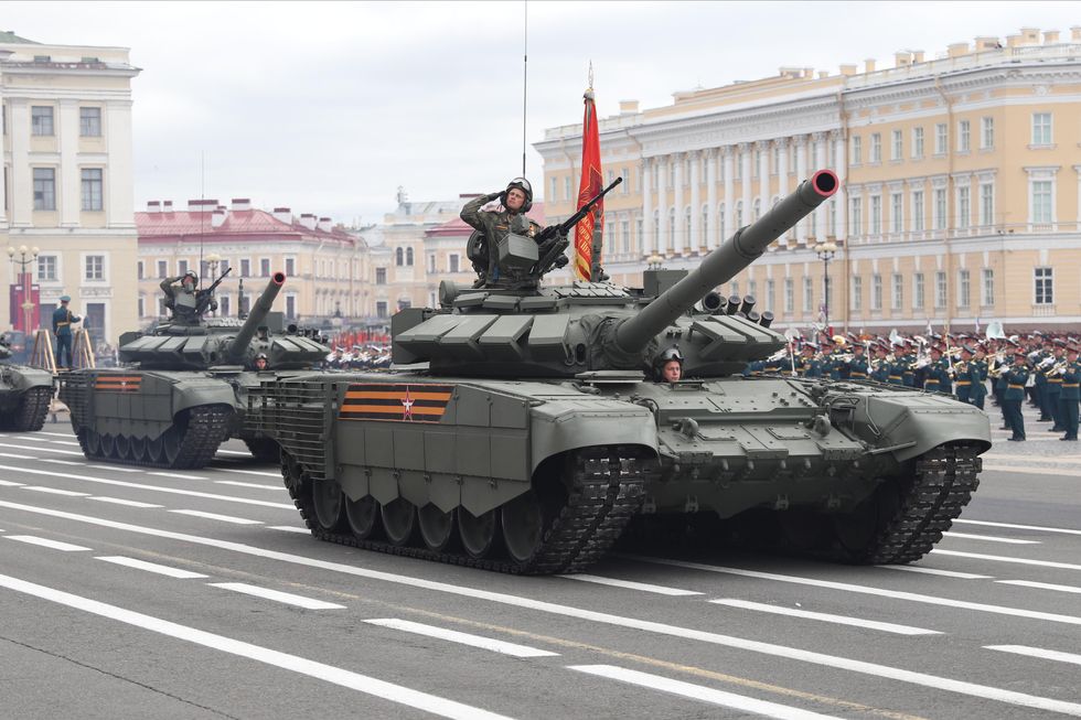 photo of a thank with a soldier saluting in the main square