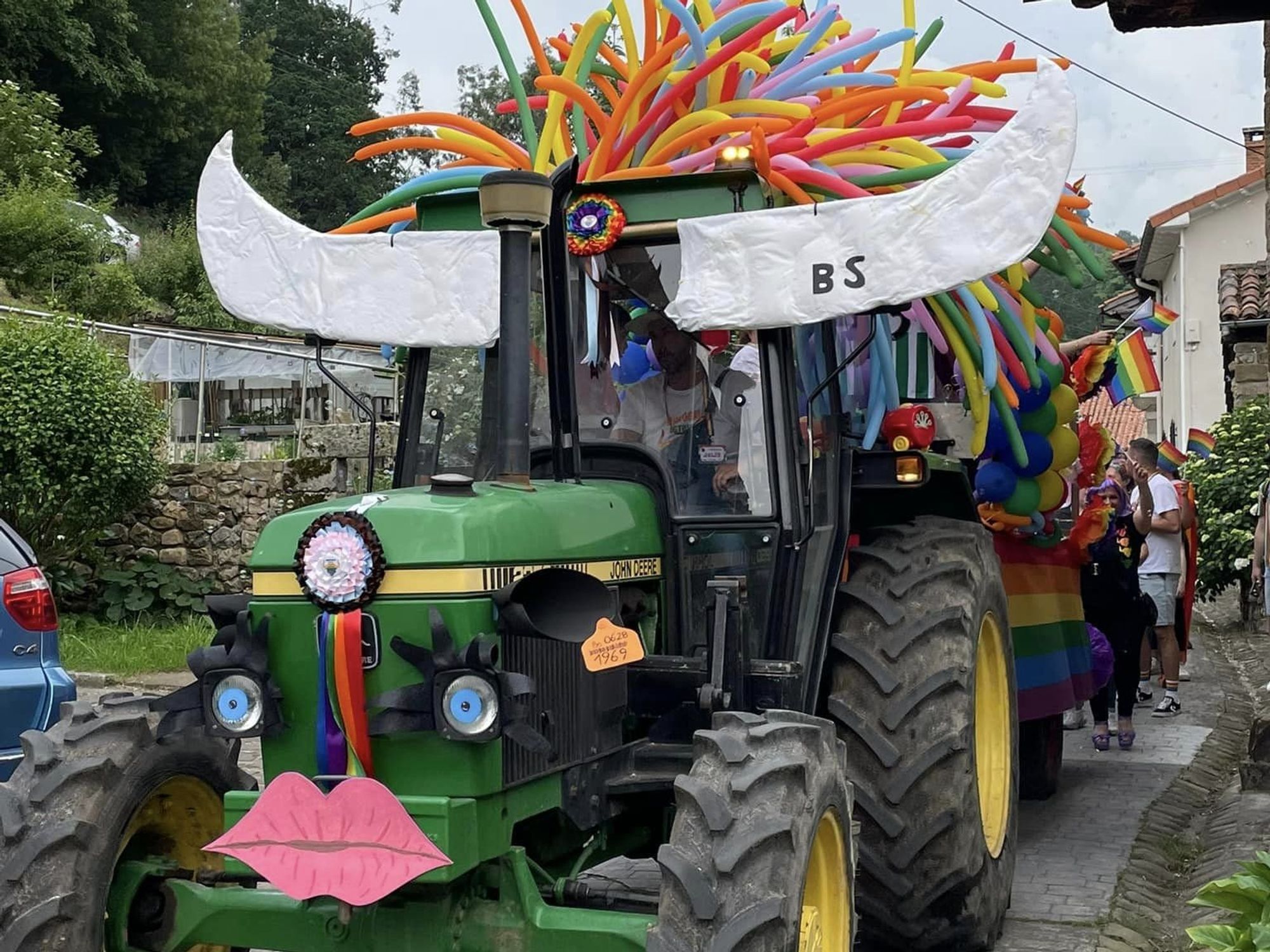 Photo of a tractor decorated with the pride colours