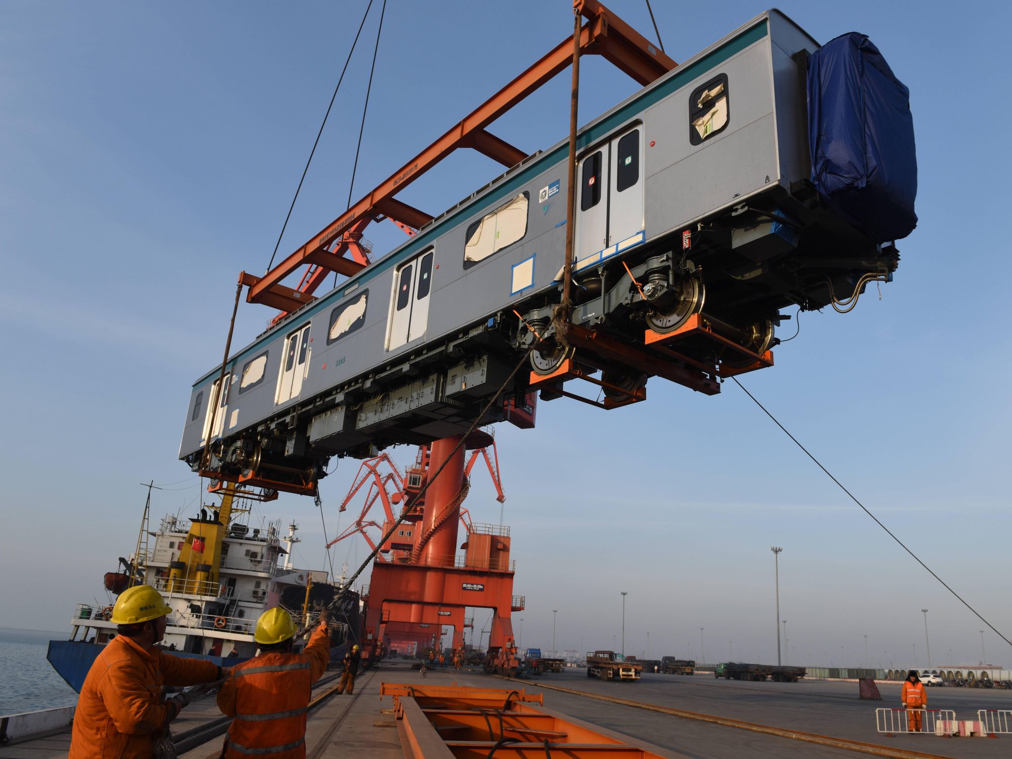 Photo of a train car lifted by a crane